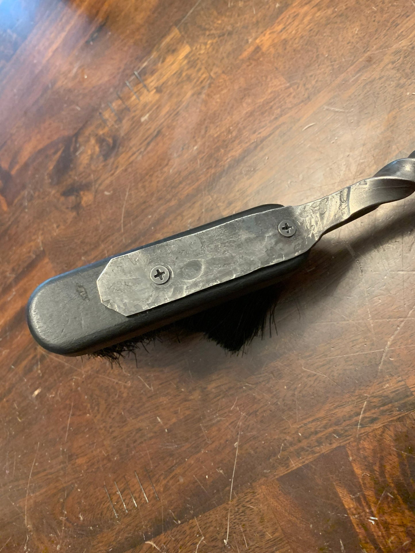 Hand forged and hand finished fireplace brush. Forged crook end for hanging and 18”-20” in length