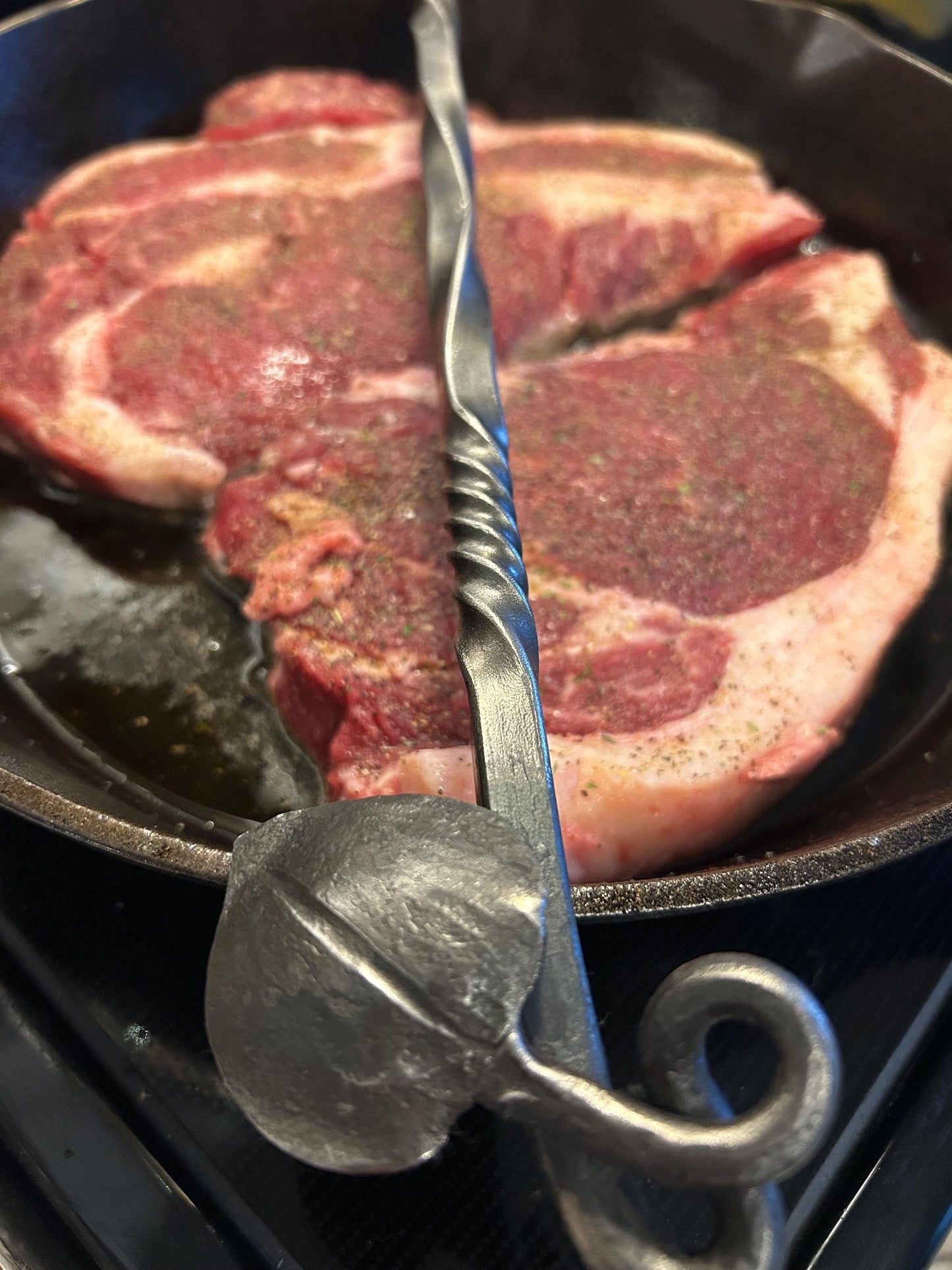 Hand forged meat turner. 3/8” carbon steel. Light yet strong with a forge finish and leaf end. 16” long