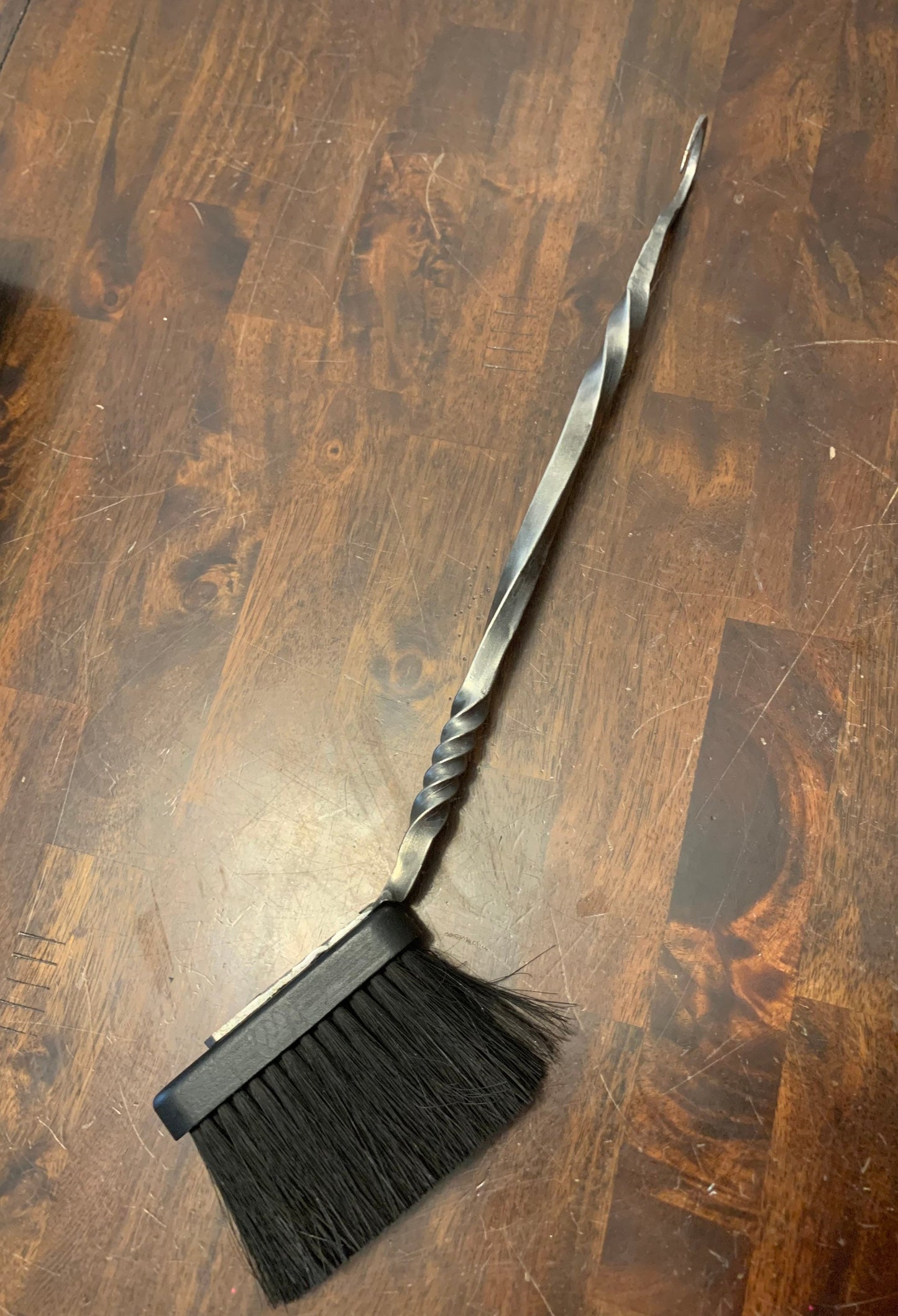 Hand forged and hand finished fireplace brush. Forged crook end for hanging and 18”-20” in length