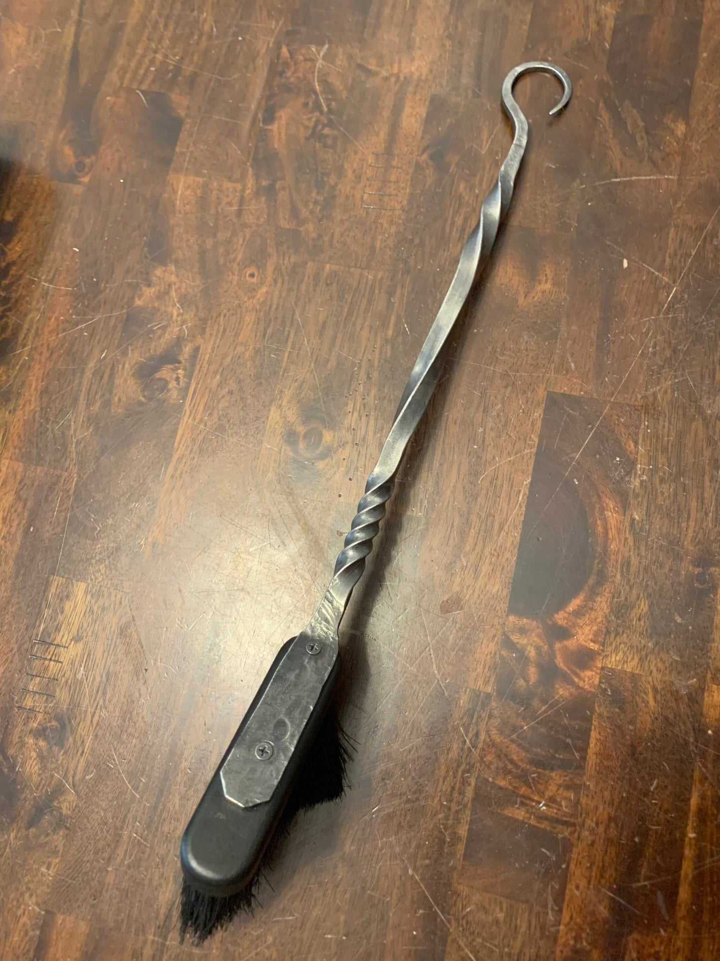 Hand forged and hand finished fireplace brush. Forged crook end for hanging and 18”-20” in length